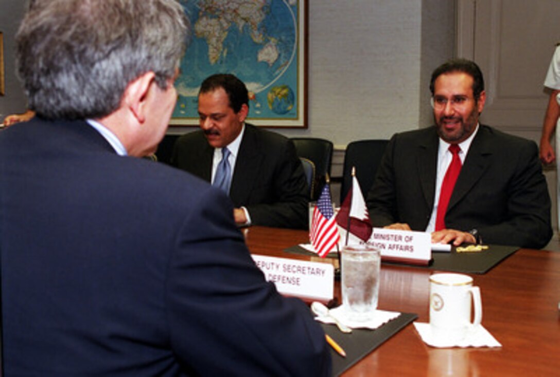 Minister of Foreign Affairs Sheikh Hamad bin Jasim bin Jabir Al-Thani (right), of the State of Qatar, meets with Deputy Secretary of Defense Paul Wolfowitz (left) at the Pentagon on May 3, 2001. The two diplomats, joined by Qatar's Ambassador to the United States Badr Umar Al-Dafa (center), are discussing a range of security issues of interest to both nations. 