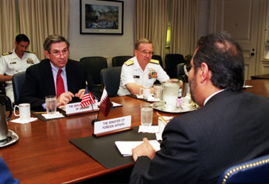 Deputy Secretary of Defense Paul Wolfowitz (left) chairs a meeting with Minister of Foreign Affairs Sheikh Hamad bin Jasim bin Jabir Al-Thani (right), of the State of Qatar, at the Pentagon on May 3, 2001. Navy Vice Admiral Walter F. Doran (center), assistant to the Chairman of the Joint Chiefs of Staff, joined in the discussions of security issues of interest to both nations. 