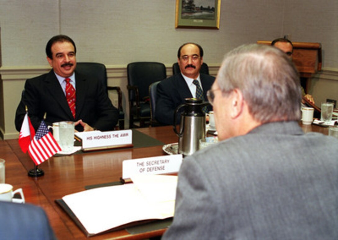 His Highness Hamad bin Isa Al-Khalifa (left), the amir of Bahrain, meets with Secretary of Defense Donald H. Rumsfeld (right) in the Pentagon on May 8, 2001. Rumsfeld and the Amir are meeting to discuss regional security issues of interest to both nations. Bahrain's Ambassador to the United States Muhammed Abdul Ghaffar (center) joined the Amir and Rumsfeld in the discussions. 