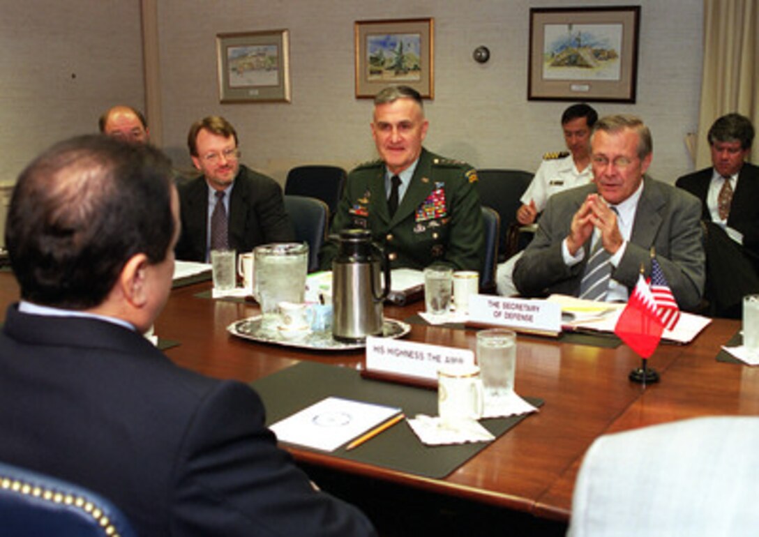 Secretary of Defense Donald H. Rumsfeld (right) meets in the Pentagon with the Amir of Bahrain, His Highness Hamad bin Isa Al-Khalifa (foreground) on May 8, 2001. Rumsfeld and the Amir were joined in the talks by (left to right) Special Assistant to the Secretary of Defense on Policy Matters Chris Williams and Chairman of the Joint Chiefs of Staff Gen. Henry H. Shelton, U.S. Army. 