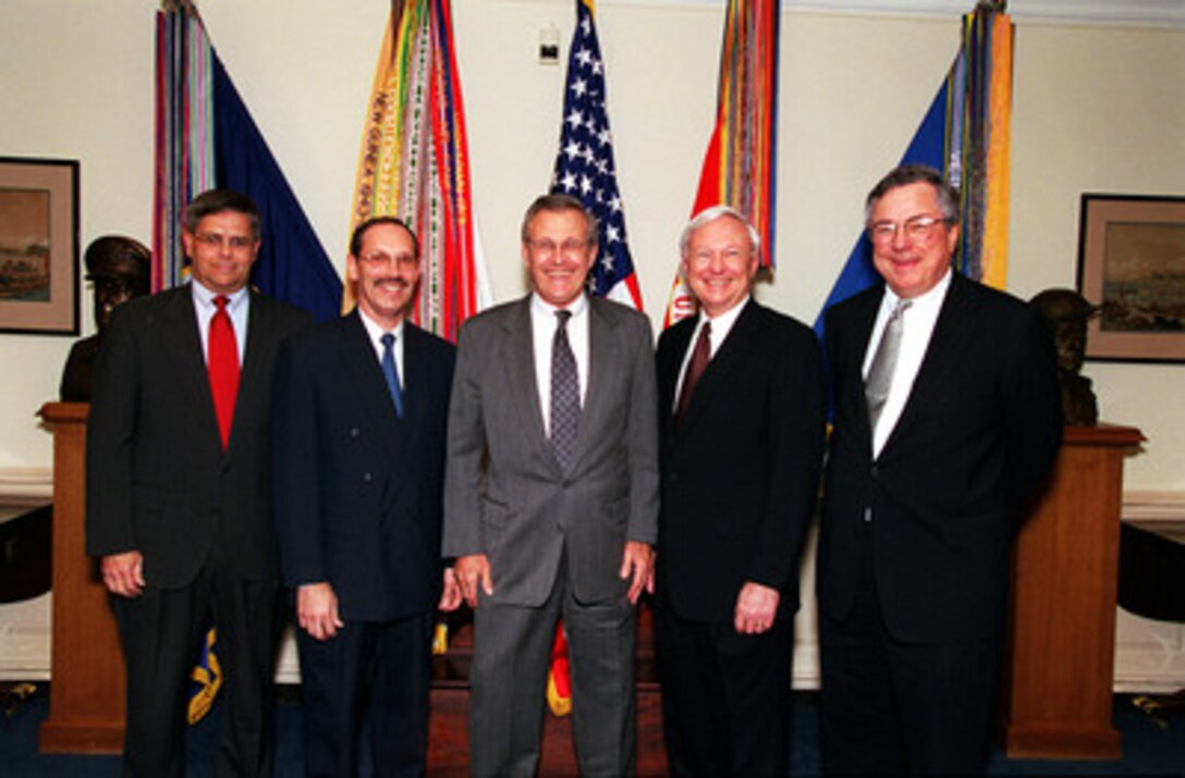 Secretary of Defense Donald H. Rumsfeld (center) poses with some members of his newly appointed staff in the Pentagon on May 11, 2001. From left to right is Assistant Secretary of Defense for Force Management Policy Charles S. Abell, Under Secretary of Defense (Comptroller) Dov S. Zakheim, Rumsfeld, Under Secretary of Defense for Acquisition, Technology and Logistics Edward C. "Pete" Aldridge Jr., and Assistant Secretary of Defense for Legislative Affairs Powell A. Moore. 