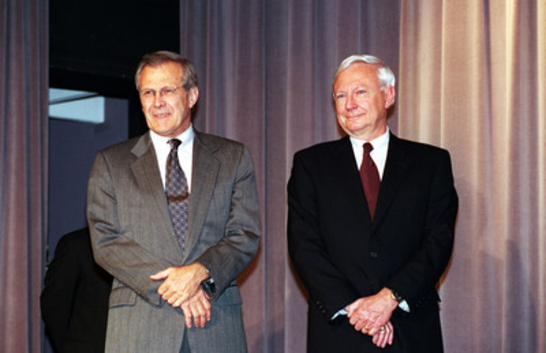 Secretary of Defense Donald H. Rumsfeld (left) and Under Secretary of Defense for Acquisition, Technology and Logistics Edward C. "Pete" Aldridge Jr., listen to remarks at a swearing in ceremony in the Pentagon on May 11, 2001. Aldridge will be the principal advisor to the secretary for all matters relating to the acquisition of weapons and material, including research and development, testing and evaluation, production, logistics, military construction and procurement. 