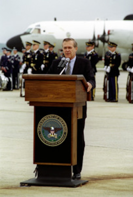 Secretary of Defense Donald H. Rumsfeld makes remarks during the opening ceremony of the Joint Services Open House at Andrews Air Force Base, MD, May 18, 2001. In the background is a U.S. Navy EP-3 aircraft, similar to the one used by the crew who were forced to make an emergency landing April 1, 2001, on Hanian Island, Peoples Republic of China. The 24 member crew were presented awards during the ceremony which drew thousands of spectators. 