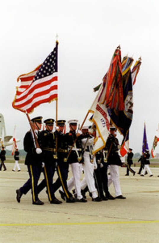 The Joint Armed Services Color Guard pass in review during the opening ceremony of the Joint Services Open House at Andrews Air Force Base, MD, May 18, 2001. 