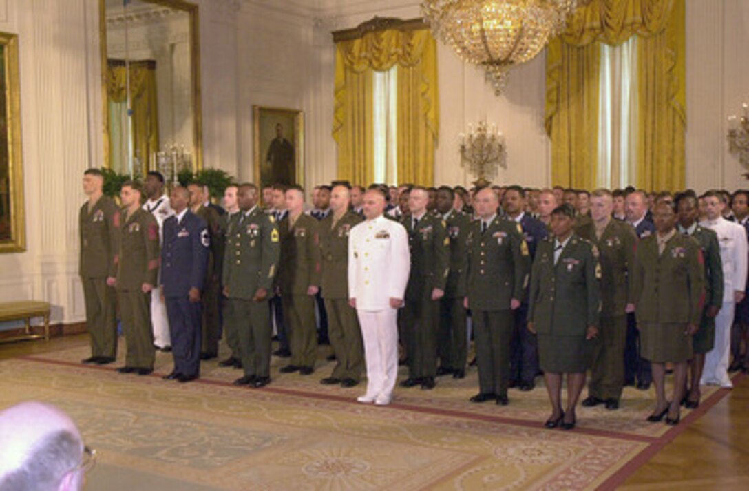 At the White House President George W. Bush hosted a reenlistment ceremony for 100 servicemembers representing each of the Armed Forces on May 23, 2001. Secretary of Defense Donald H. Rumsfeld delivered the opening remarks and Chairman of the Joint Chiefs of Staff Gen. Henry H. Shelton administered the oath of enlistment. President Bush and Defense Secretary Donald Rumsfeld both spoke before the reenlistment ceremony, with Rumsfeld telling the troops their task now is to "protect our country from the unknown, uncertain, unseen and unexpected." 