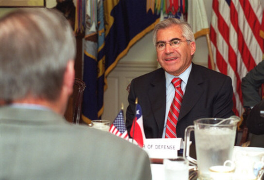 Chilean Minister of Defense Mario Fernandez (right) meets with Secretary of Defense Donald H. Rumsfeld (left) at the Pentagon, May 24, 2001. Fernandez, in Washington, D. C., to deliver the keynote address at the Seminar on Research and Education in Defense and Security Studies being held at the National Defense University, used the opportunity to stop by the Department of Defense to discuss some issues of mutual interest with Rumsfeld. Chile's planned purchase of U.S. F-16 fighter aircraft was one of several topics under discussion. 