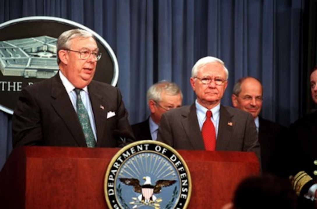 Secretary of the Air Force James G. Roche (left) announces the selection of Lockheed Martin, teamed with Northrop Grumman and BAE, to develop and then produce the Joint Strike Fighter at a Pentagon press conference on Oct. 26, 2001. The Joint Strike Fighter is a multi-service, multi-nation, family of warplanes which will be produced in three versions to fit the requirements of the U.S. Air Force, Navy, and Marine Corps as well as the British Royal Air Force and Navy. The program is the largest acquisition program in the history of the Department of Defense. Standing to the right of Roche is Under Secretary of Defense for Acquisition, Technology and Logistics Edward C. "Pete" Aldridge Jr. 