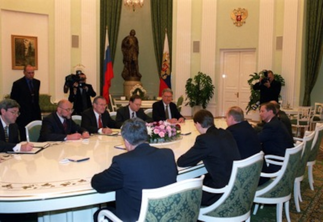 Secretary of Defense Donald H. Rumsfeld (3rd from left) meets with Russian President Vladimir Putin in the Kremlin on Nov. 3, 2001. Rumsfeld's visit to Moscow is laying the groundwork for next week's summit meeting in the United States between Putin and George W. Bush. Also participating in the meeting are from left to right: Under Secretary of Defense for Policy Douglas Feith, State Department interpreter Alexei Sobchenko, Rumsfeld, U.S. Ambassador to Russia Alexander Vershbow, and Senior Deputy Director Counter & Non-Proliferation Strategy Bob Joseph. 