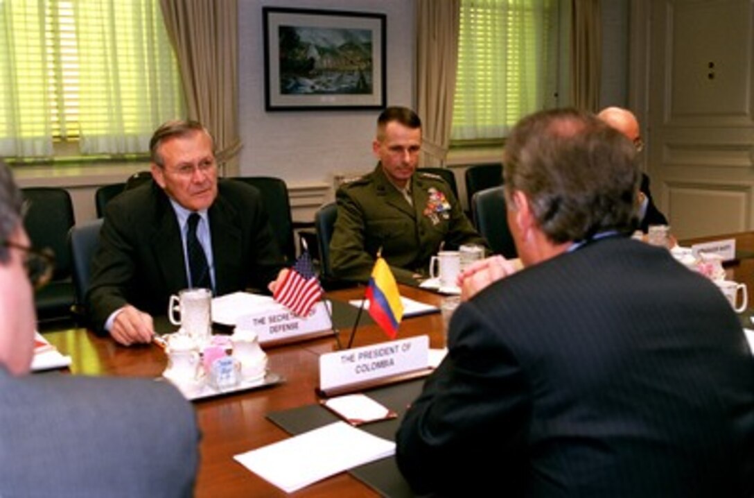 Secretary of Defense Donald H. Rumsfeld (left) meets with Colombian President Andres Pastrana (right) in the Pentagon on Nov. 9, 2001. Pastrana is meeting with Rumsfeld and Deputy Secretary of Defense Paul Wolfowitz to discuss a range of bilateral security issues of interest to both nations. Vice Chairman of the Joint Chiefs of Staff Gen. Peter Pace (center) joined in the talks. 