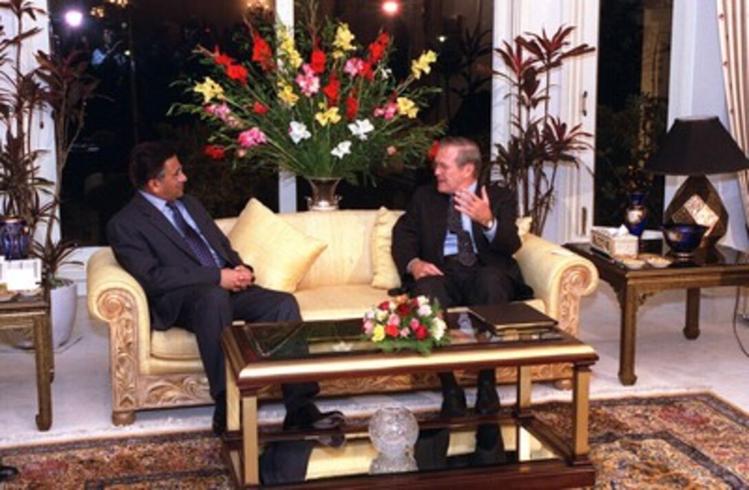 Secretary of Defense Donald H. Rumsfeld (right) meets with Pakistan President Pervez Musharraf, at the presidential offices in Islamabad, on Nov. 4, 2001. Rumsfeld and Musharraf are discussing the war against the Taliban and al-Qaeda terrorists in Afghanistan as well as a range of bilateral security issues. 
