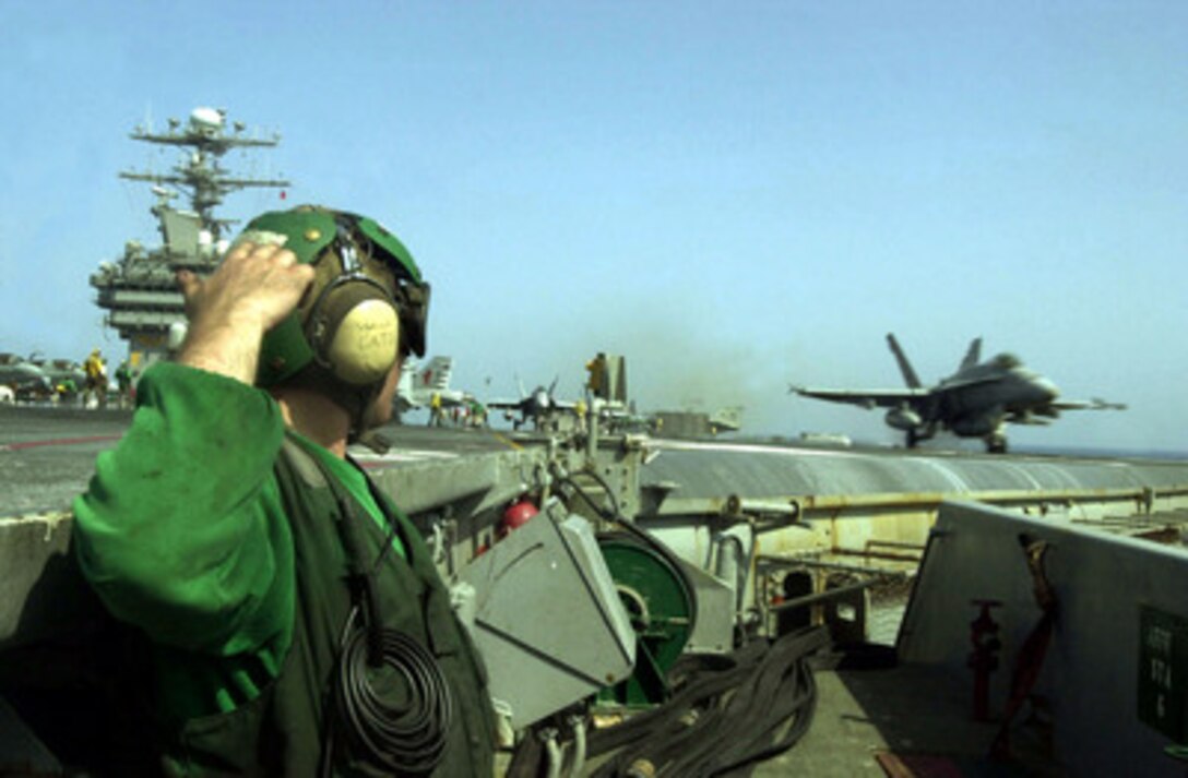An F/A-18C Hornet is launched from the aircraft carrier USS Carl Vinson (CVN 70) in a strike against al Qaeda terrorist training camps and military installations of the Taliban regime in Afghanistan on Oct. 7, 2001. The carefully targeted actions are designed to disrupt the use of Afghanistan as a base for terrorist operations and to attack the military capability of the Taliban regime. The USS Carl Vinson (CVN 70) is operating in the Arabian Sea as part of Operation Enduring Freedom. 