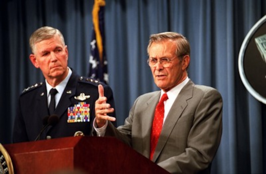Secretary of Defense Donald H. Rumsfeld (right) announces the military strikes against al Qaeda terrorist training camps and military installations of the Taliban regime in Afghanistan during a Pentagon press briefing on Oct. 7, 2001. Chairman of the Joint Chiefs of Staff Gen. Richard B. Myers, U.S. Air Force, joined Rumsfeld for the announcement. The carefully targeted actions are designed to disrupt the use of Afghanistan as a base for terrorist operations and to attack the military capability of the Taliban regime. 