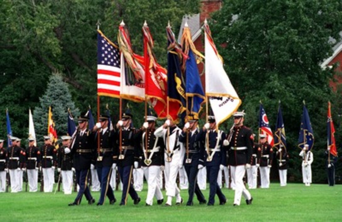The Joint Service Color Guard advances the colors during the retirement ceremony of Chairman of the Joint Chiefs of Staff Gen. Henry H. Shelton, at Fort Myer, Va., on Oct. 2, 2001. 