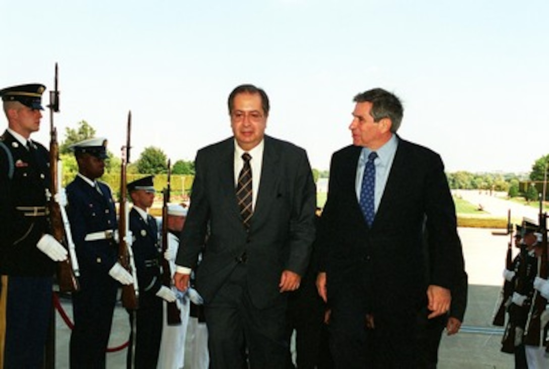 Minister of Foreign Affairs Jaime Gama (left), of Portugal, is escorted through an honor cordon and into the Pentagon by Deputy Secretary of Defense Paul Wolfowitz (right) on Oct. 3, 2001. 