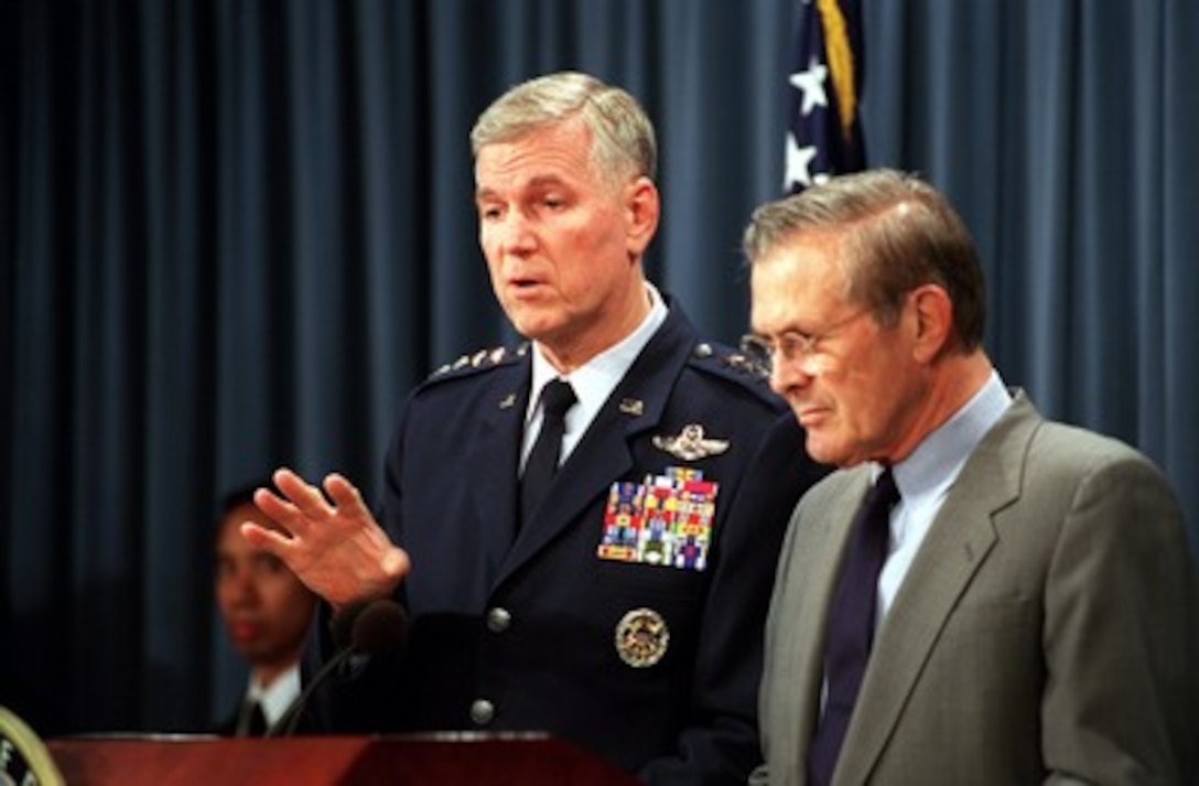 Chairman of the Joint Chiefs of Staff Gen. Richard B. Myers, U.S. Air Force, responds to a reporter's question during a Pentagon press briefing with Secretary of Defense Donald H. Rumsfeld on Oct. 9, 2001. Myers and Rumsfeld reported on the bombing of targets in Afghanistan and the progress of Operation Enduring Freedom. 