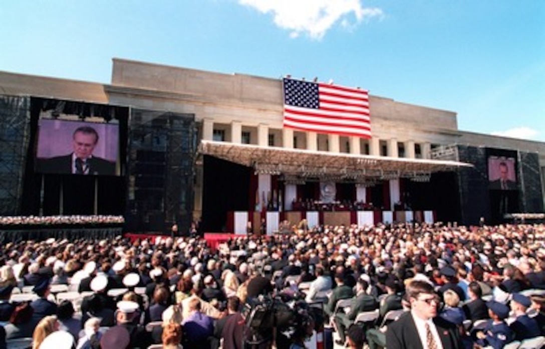 Secretary of Defense Donald H. Rumsfeld addresses the audience during the Pentagon memorial service on Oct. 11, 2001, in honor of those who perished in the terrorist attack on the building one-month earlier. President George W. Bush, Rumsfeld and Chairman of the Joint Chiefs of Staff Gen. Richard B. Myers, U.S. Air Force, eulogized the 184 persons killed when a terrorist hijacked airliner was purposely crashed into the southwest face of the building on Sept. 11, 2001. 