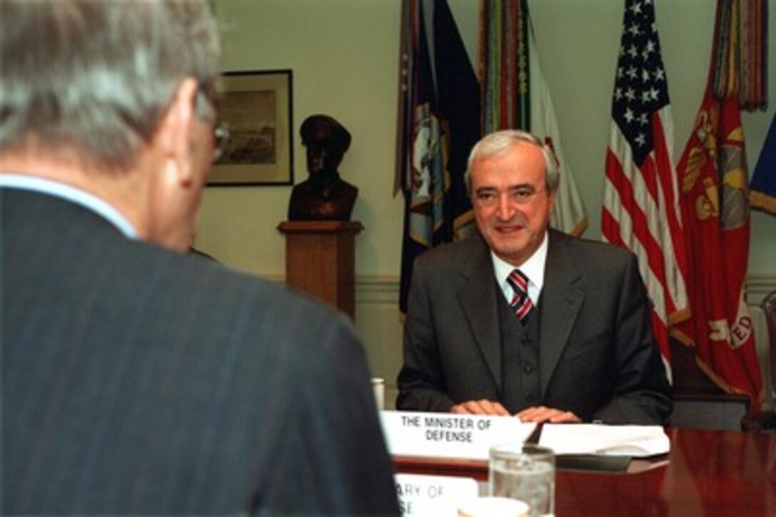 Italian Minister of Defense Antonio Martino (right) meets with Secretary of Defense Donald H. Rumsfeld (right) in the Pentagon on Oct. 18, 2001. Martino and Rumsfeld are discussing the war on terrorism including the current military operations underway in Afghanistan. 