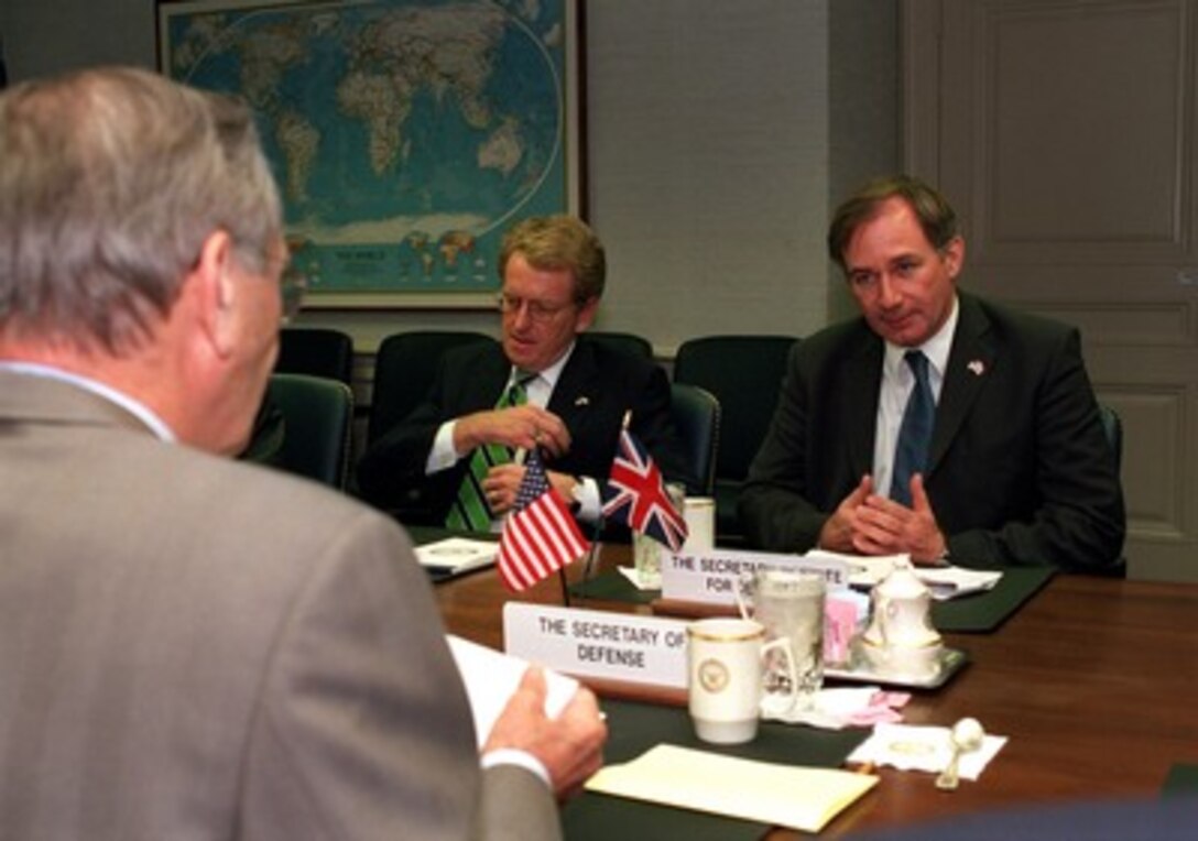 Secretary of State for Defence Geoffrey Hoon (right), of the United Kingdom, meets with Secretary of Defense Donald H. Rumsfeld (left) in the Pentagon on Oct. 30, 2001. Hoon and Rumsfeld are meeting to discuss the progress of the war against terrorism including the present military campaign against Taliban and al Qaeda forces in Afghanistan. Also participating in the talks was Ambassador Christopher Meyer (center), the UK's ambassador to the U.S. 