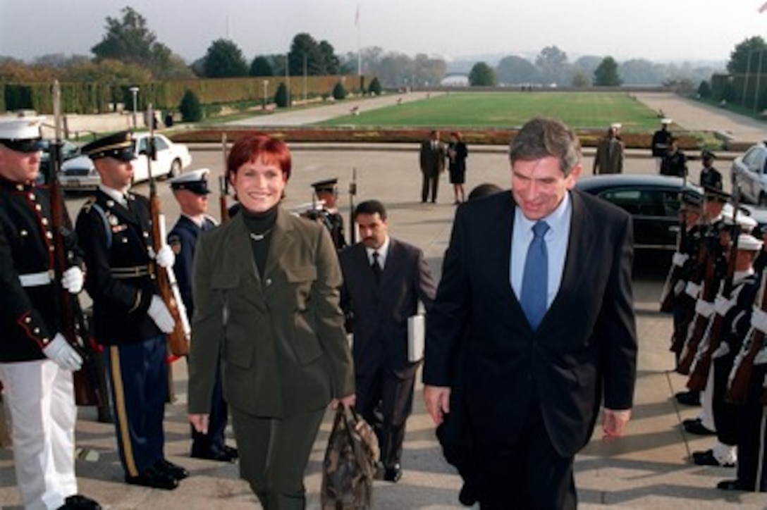 Deputy Secretary of Defense Paul Wolfowitz (right) escorts Princess Aisha bin al-Hussein, of Jordan, into the Pentagon on Oct. 23, 2001. Princess Aisha is the sister of King Abdullah, ruler of the Hashemite Kingdom of Jordan. 