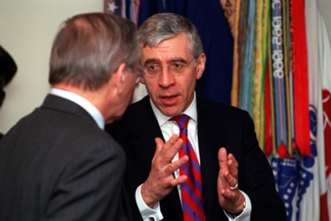 Secretary of State for Foreign and Commonwealth Affairs Jack Straw (right), of the United Kingdom, discusses the war on terrorism with Secretary of Defense Donald H. Rumsfeld (left) at the Pentagon on Oct. 24, 2001. 