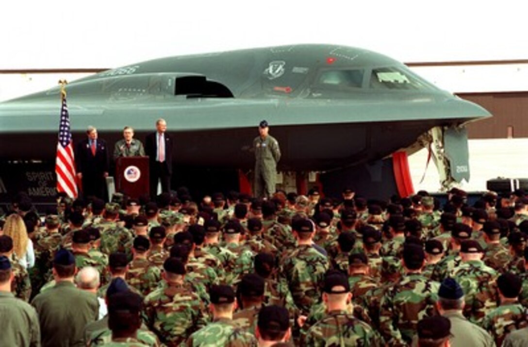 With a B-2 Spirit bomber as a backdrop, Secretary of Defense Donald H. Rumsfeld (2nd from left) thanks the men and women at Whiteman Air Force Base, Mo., on Oct. 19, 2001, for their efforts in bringing the fight to the terrorists in Afghanistan. Rumsfeld, Sen. Christopher "Kit" Bond (left) and Rep. Ike Skelton (2nd from right), both of Missouri, visited the base as the guest of Brig. Gen. Anthony F. Przybyslawski (right), commander of the 509th Bomb Wing which operates the B-2. Planes from the 509th have flown missions over Afghanistan during Operation Enduring Freedom. 