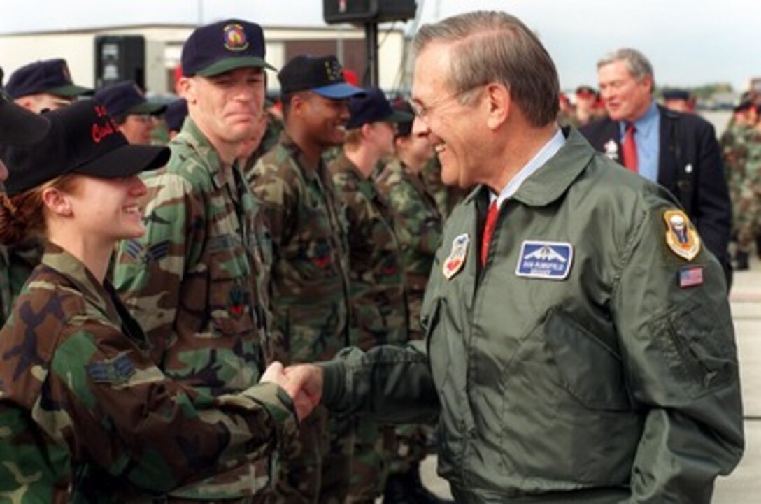 Secretary of Defense Donald H. Rumsfeld shakes hands with Air Force personnel at Whiteman Air Force Base, Mo., on Oct. 19, 2001. Whiteman is the home of the B-2 Spirit bomber, which is operated exclusively by the 509th Bomb Wing. Planes from the 509th have flown missions over Afghanistan during Operation Enduring Freedom. 