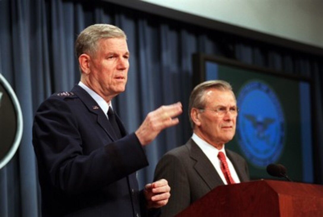 Chairman of the Joint Chiefs of Staff Gen. Richard B. Myers (left), U.S. Air Force, and Secretary of Defense Donald H. Rumsfeld (right) conduct an operational update briefing on Operation Enduring Freedom in the Pentagon on Oct. 22, 2001. Myers briefed reporters about the air strikes in Afghanistan and the dropping of humanitarian daily rations to Afghan refugees. Over 700,000 rations have been dropped over Afghanistan since the beginning of the operation. 