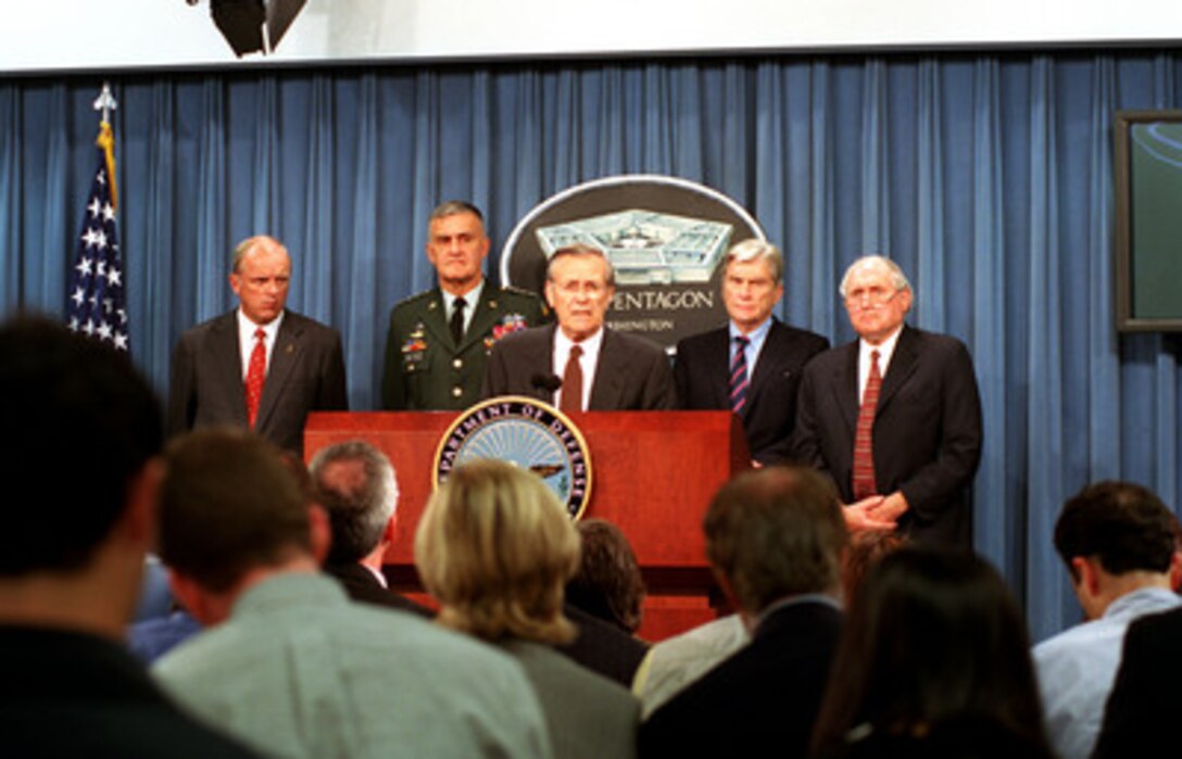 Secretary of Defense Donald H. Rumsfeld (center) conducts a news briefing on the terrorist attack of the Pentagon on Sept. 11, 2001. Army Secretary Thomas White (left), Chairman of the Joint Chiefs of Staff Gen. Henry H. Shelton (2nd from left), Sen. John Warner (2nd from right), R-Va., and Sen. Carl Levin (right), D-Mich., joined Rumsfeld in the briefing in the Pentagon. 