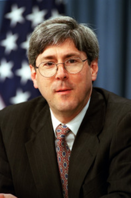 Under Secretary of Defense for Policy Douglas J. Feith listens to a reporter's question during a Pentagon media roundtable on Sept. 4, 2001. 
