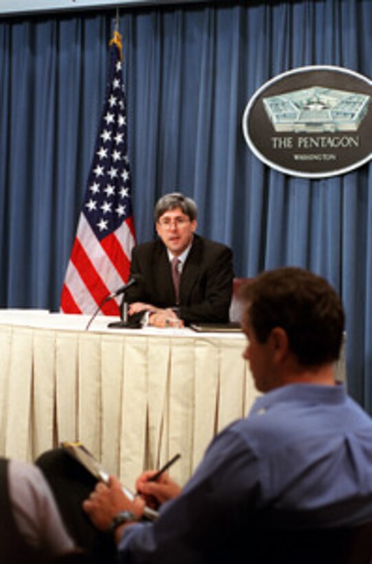 Under Secretary of Defense for Policy Douglas J. Feith responds to a reporter's question during a Pentagon media roundtable on Sept. 4, 2001. 