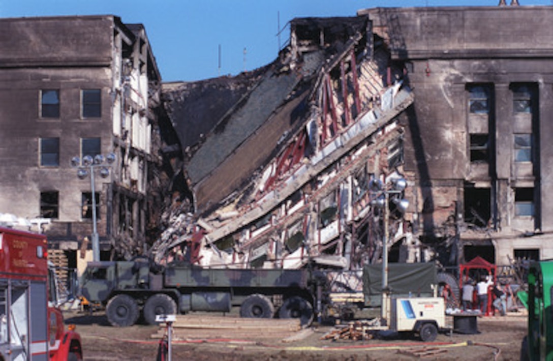 The west-facing wall of the Pentagon sags on Sept. 12, 2001, where a hijacked American Airlines flight with 64 passengers aboard was purposely crashed into this spot in an act of terrorism. 
