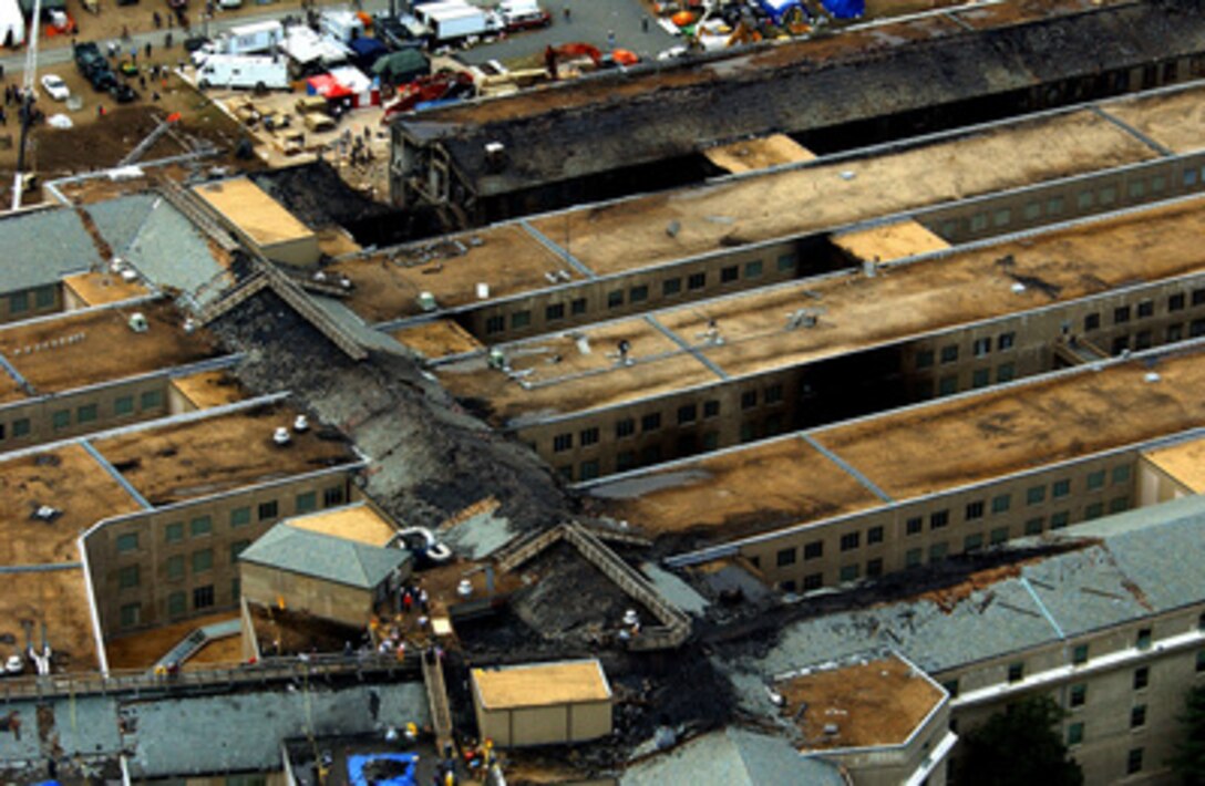This aerial photograph of the Pentagon taken on Sept. 14, 2001, shows some of the destruction caused when the hijacked American Airlines flight slammed into the building on Sept. 11. The terrorist attack caused extensive damage to the west face of the building and followed similar attacks on the twin towers of the World Trade Center in New York City. 
