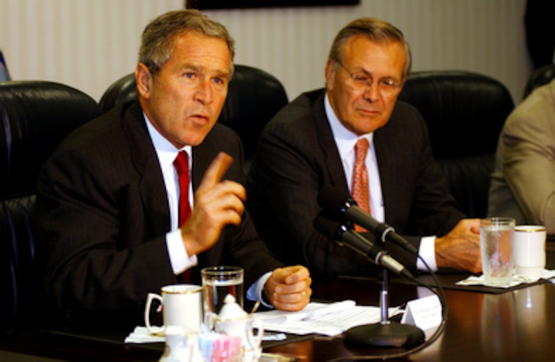 President George W. Bush answers a question about Osama bin Laden during a media opportunity held after meeting with Defense Secretary Donald H. Rumsfeld and the National Security team at the Pentagon on Sept. 16, 2001. 