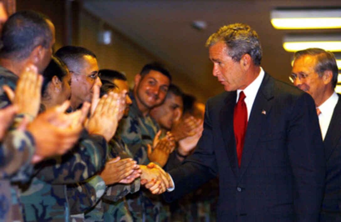 President George W. Bush shakes hands with members of the Guard and Reserve in the Pentagon after attending a meeting with his National Security team on Sept. 16, 2001. Bush has authorized the call-up of up to 50,000 Guard and Reserves to augment actively. 
