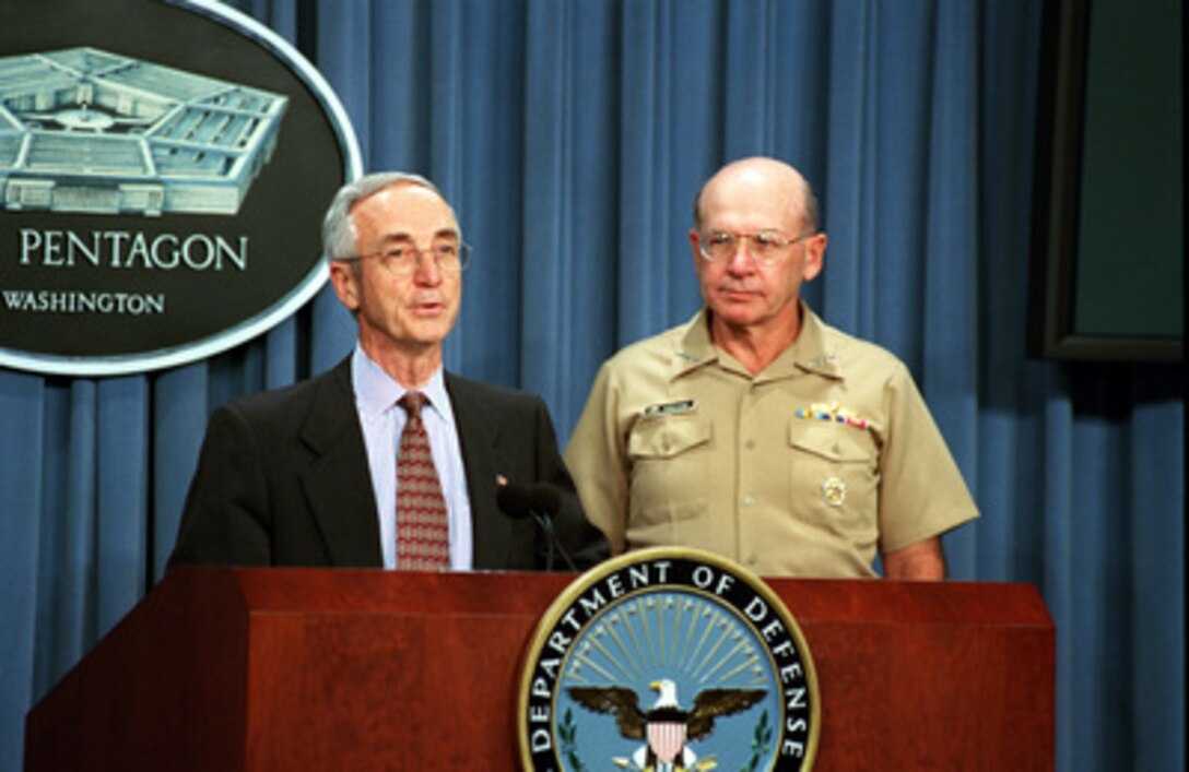Secretary of the Navy Gordon England makes a statement in the Pentagon briefing room on Sept. 13, 2001, concerning naval personnel listed as missing from the Sept. 11th terrorist attack on the Pentagon. Chief of Naval Operations Adm. Vernon Clark (right) accompanied England to the briefing. 