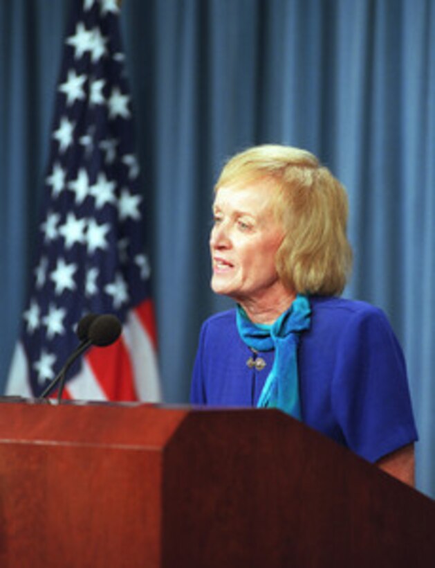 Meg Falk, director of the Department of Defense Office of Family Policy, addresses reporters at the Pentagon on Sept. 12, 2001. Falk provided information on the establishment of a family assistance center for the dissemination of information and assistance to families who might have had a member injured or killed in the Sept. 11 attack on the Pentagon. The terrorist attack caused extensive damage to the west face of the building and followed similar attacks on the twin towers of the World Trade Center in New York City. 