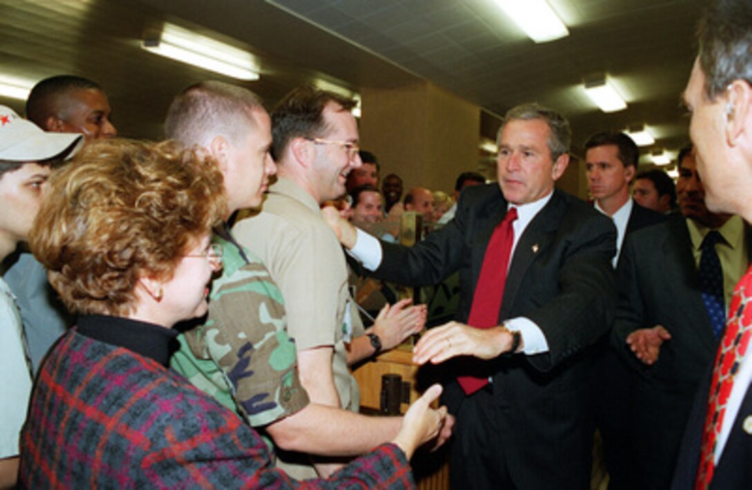 President George W. Bush pays a surprise visit to the Pentagon cafeteria on Sept. 17, 2001, to informally greet and thank Pentagon personnel for their dedication and perseverance. Bush and Vice President Dick Cheney met earlier with Secretary of Defense Donald H. Rumsfeld and other members of the national security team at the Pentagon. 
