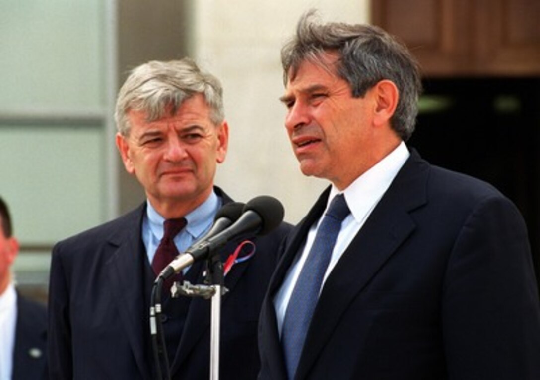 Deputy Secretary of Defense Paul Wolfowitz (right) responds to a reporter's question during a joint media availability with German Foreign Minister Joschka Fischer (left) at the Pentagon, on Sept. 19, 2001. Fischer met earlier with Wolfowitz to hear his assessment of the Sept. 11th terrorist attacks on the United States and to discuss the planned war on terrorism being advocated by President George W. Bush. 