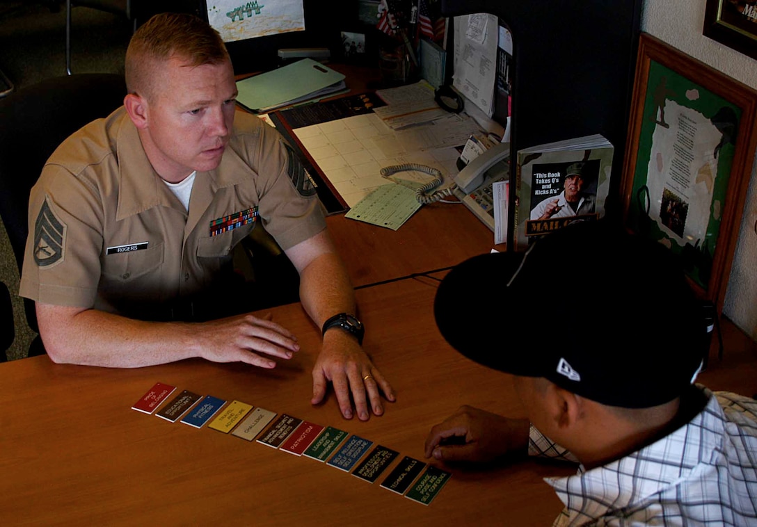 Staff Sgt. Gregory S. Rogers, a recruiter at Marine Corps Recruiting Sub-station Oceanside, Ca., discusses future plans with a prospective recruit.