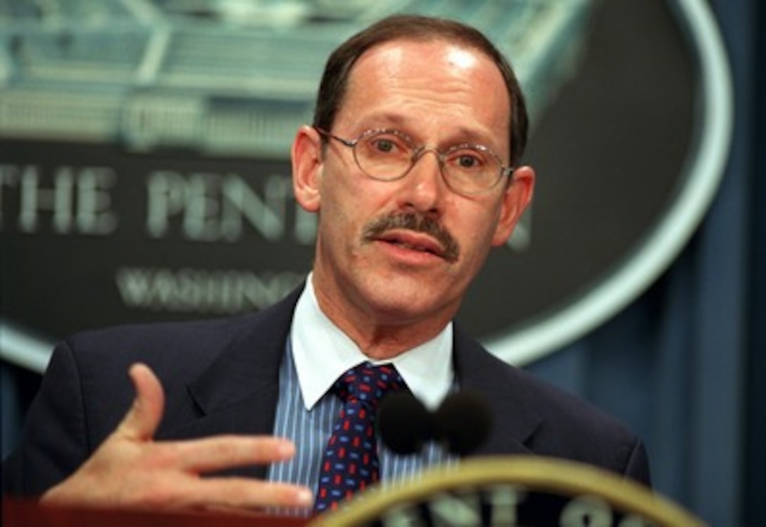 Under Secretary of Defense (Comptroller) Dov Zakheim briefs reporters on problems involving fraud and misuse of government issued travel and purchase cards during a March 27, 2002, Pentagon press conference. Zakheim announced the formation of a task force to propose legislation or administrative changes to correct the misuse. 