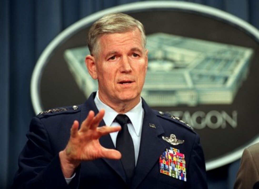 Chairman of the Joint Chiefs of Staff Gen. Richard B. Myers (left), U.S. Air Force, briefs reporters in the Pentagon on March 28, 2002, on the latest developments in the war on terrorism. 