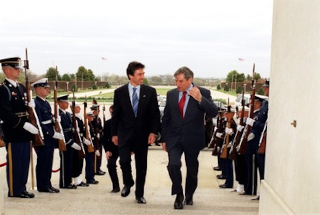 Deputy Secretary of Defense Paul Wolfowitz (right) escorts Danish Prime Minister Anders Fogh Rasmussen (left) into the Pentagon on March 27, 2002. Wolfowitz and Rasmussen will meet to discuss defense issues of mutual interest. 