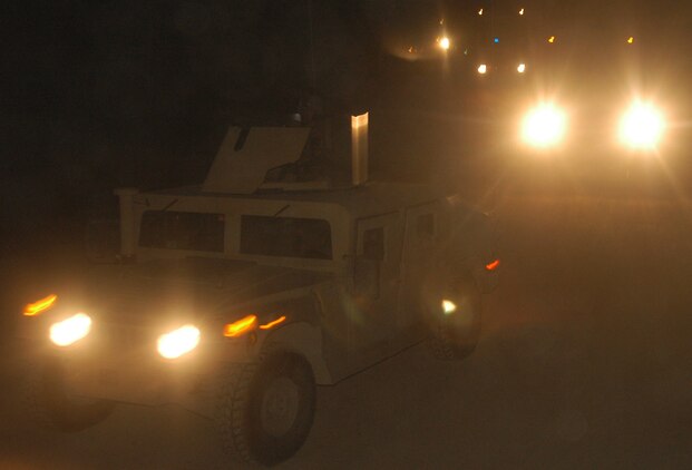 CAMP BLUE DIAMOND, RAMADI, Iraq (May 7, 2005) - Marine tactical vehicles and tractor trailer trucks pull into Camp Blue Diamond in the early morning hours after making the trip from Al Asad. The Marines of 2nd Low Altitude Air Defense Battalion, Bravo Co., 2nd Platoon have been providing security for convoys during the last three months.