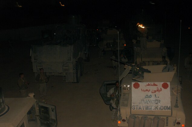 CAMP BLUE DIAMOND, RAMADI, Iraq (May 7, 2005) - Marines from 2nd Low Altitude Air Defense, Bravo Co., 2nd Platoon rest and chat after making escourting a convoy from Al Asad. The Marines of Bravo Co. have been providing security for Department of Defense contracted supply trucks for the past three months. During thier time on the road the company has logged more than 21,000 miles and escourted more than 1,600 tractor trailers.
