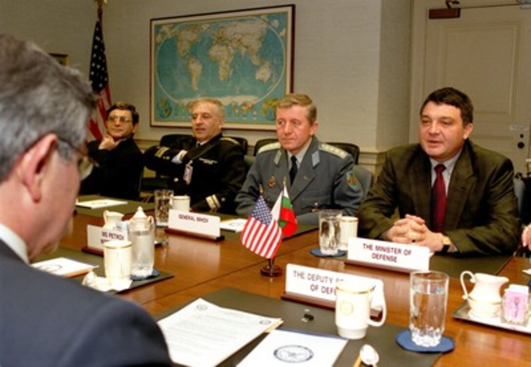 Bulgarian Minister of Defense Nikolayo Svinorov (right) and his delegation meets with Deputy Secretary of Defense Paul Wolfowitz (foreground) in the Pentagon on April 12, 2002, to discuss a broad range of bilateral security issues. Joining Svinorov in the meeting are (left to right): Director of the International Cooperation Directorate of the Bulgarian Ministry of Defense Kamen Velichov, Bulgarian Defense AttachÇ Rear Adm. Ivan Iordanov, and Chief of the Bulgarian General Staff Gen. Miho Mihov. 