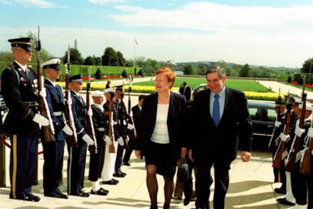Finnish President Tarja Halonen is escorted through an honor cordon and into the Pentagon by Deputy Secretary of Defense Paul Wolfowitz on April 15, 2002. Halonen and Wolfowitz will meet to discuss a range of bilateral security issues. 
