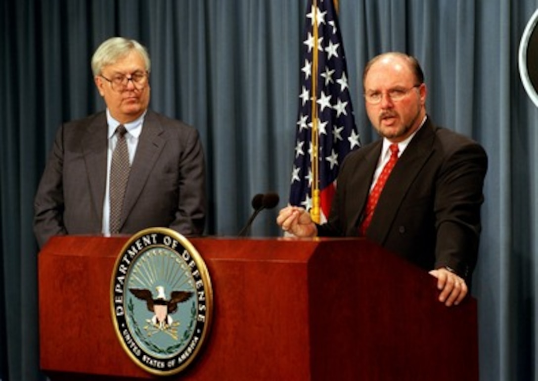 Assistant Secretary of Defense for Command, Control, Communications and Intelligence John Stenbit (left) and Director of the Public Key Infrastructure Program Office R. Michael Green hold a Pentagon press conference on July 26, 2002, to commemorate the issuance of the one millionth Public Key Infrastructure (PKI) certificate set. The PKI system, which is incorporated into the common access identification cards currently being issued to Department of Defense military and civilian employees as well as selected contractor personnel, allows the DoD to allocate electronic information access on an individual basis. The technology is an essential link in moving the department towards a network-centric information system. 
