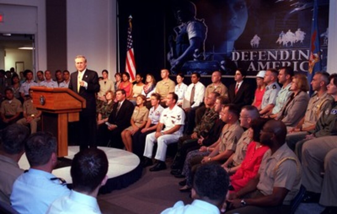 Secretary of Defense Donald H. Rumsfeld conducts a town hall meeting in the Pentagon on Aug. 6, 2002. Rumsfeld told the audience of the need for transformation in the Department of Defense. The meeting provides an opportunity for the Pentagon's military and civilian employees to ask questions of the secretary. This was Rumsfeld's third such meeting with his employees since taking office in January 2001. 