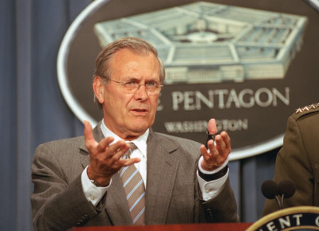 Secretary of Defense Donald H. Rumsfeld responds to a reporter's question during the Aug. 20, 2002, Pentagon press briefing. 