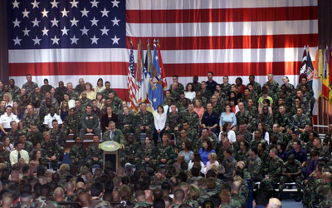 Secretary of Defense Donald Rumsfeld addresses soldiers, civilian employees, and family members at Fort Hood, Texas, during a town hall meeting on Aug. 21, 2002. 